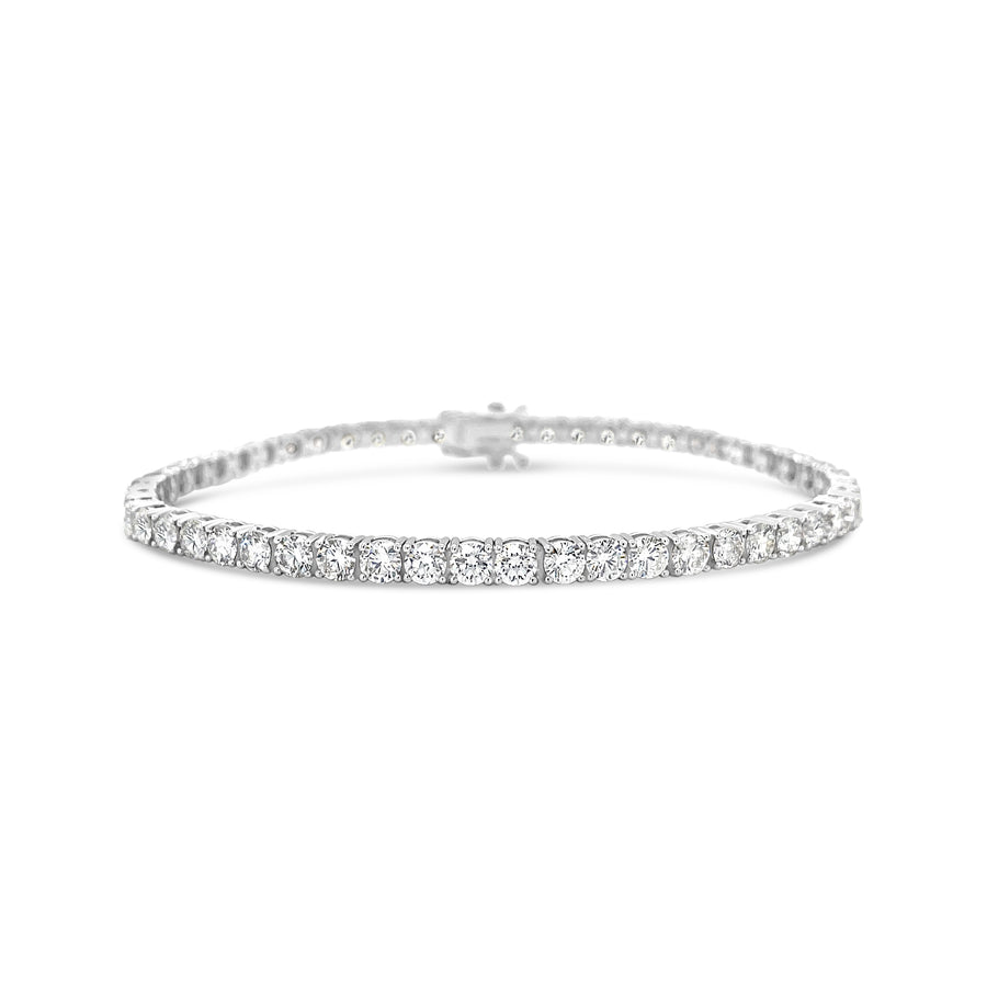 Silver bracelet with small diamonds on a white background